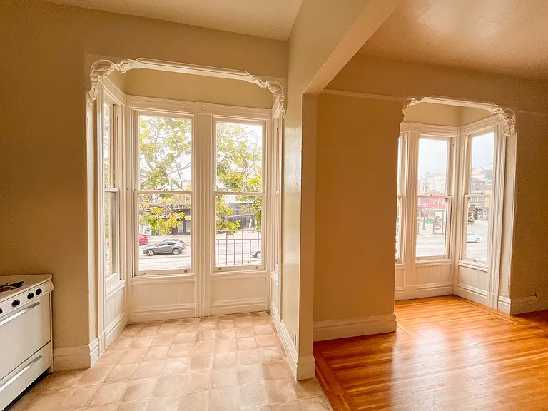 TWIN BAY WINDOWS IN KITCHEN AND LIVING ROOM