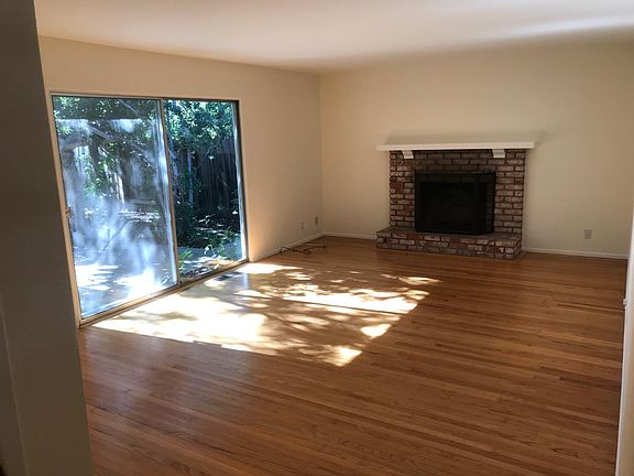 Living room opens to backyard.
