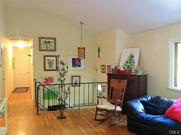 Light & Bright Living Room w/ Oak Hardwood Floors and Neutral Decor.
