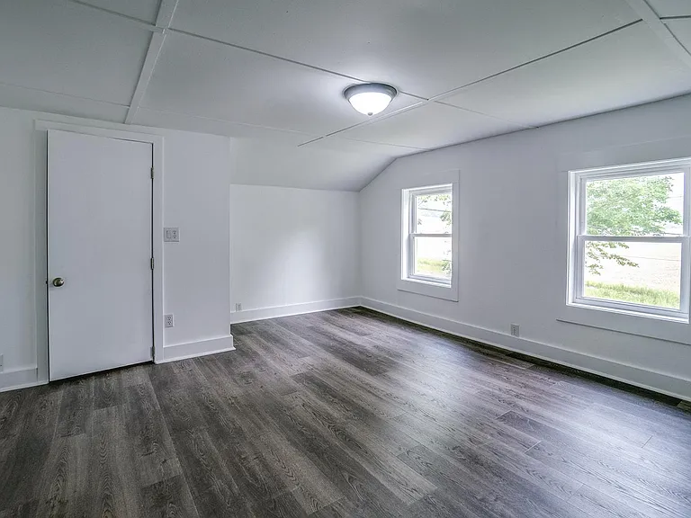 Another view of master bedroom with closet on left