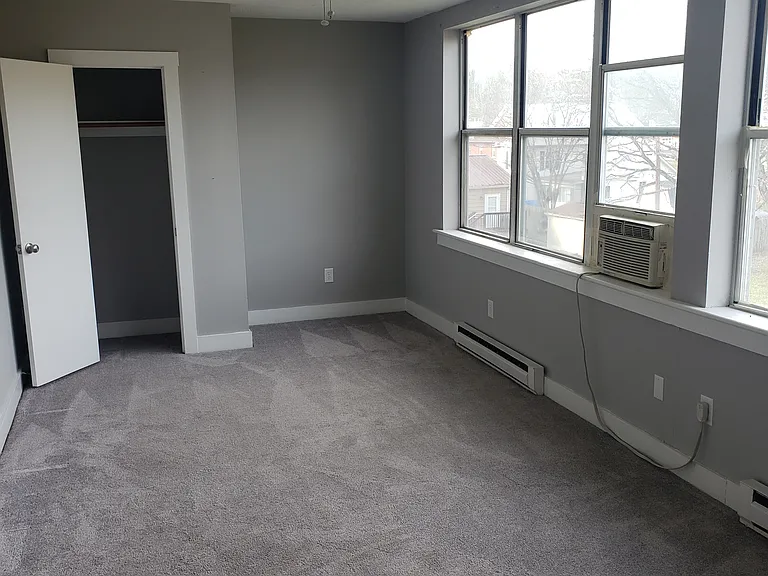 Unit 32 - Large Living Room w/ lots of natural lighting & views of the mountains!