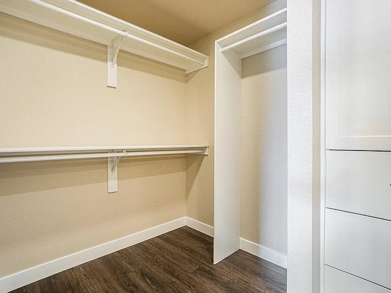 Walkin closet in primary bedroom