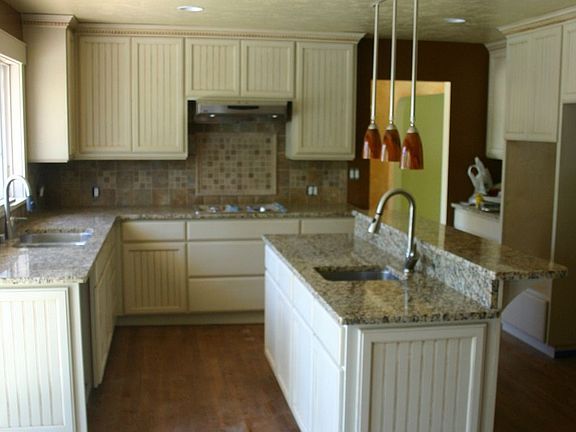 Kitchen with custom cabinets, granite and hardwoods