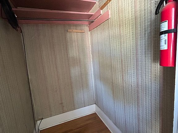 Family room closet: Not pretty, but wildly practical. This walk-in closet swallows skis and snowboarding equipment and your gear hoarding habits with zero judgment. Function fashion every time.