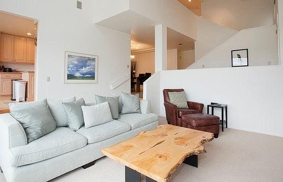 Living room with gas fireplace & wall-mounted TV