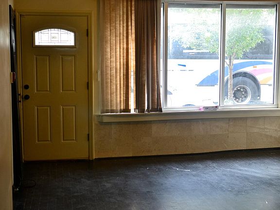 Living room and entrance to apt