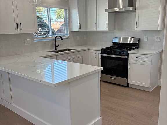 Built in spice rack and pullout shelves in pantry