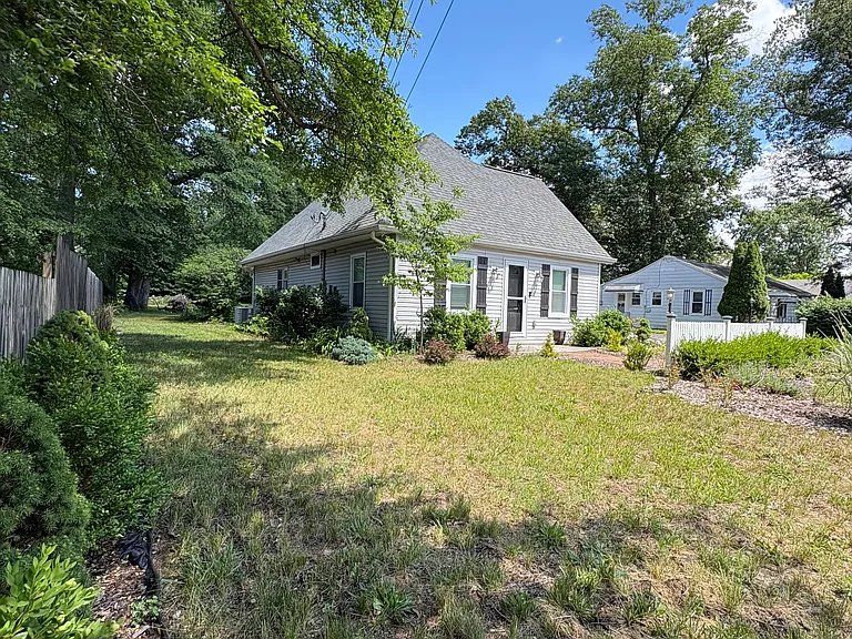 The expansive front yard enhances the home's curb appeal while providing plenty of space and a comfortable setback from the street.