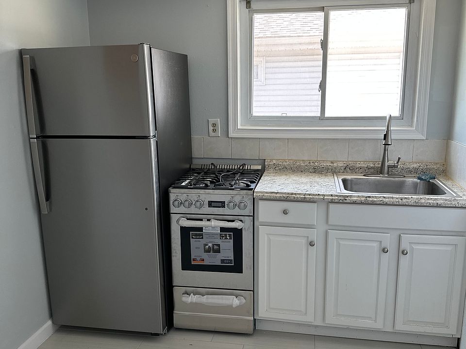 Kitchen with brand new Fridge, stove, and oven