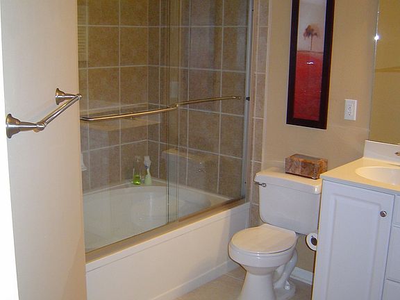 Updated Master Bathroom with glass shower enclosure and dual sinks