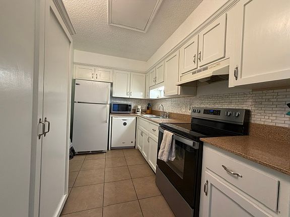 updated kitchen with large storage pantry
