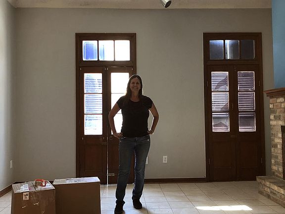 vaulted ceilings in living room with fireplace