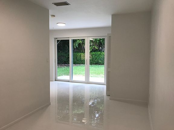 Triple wide, hurricane proof, sliding glass door to back patio and large, private, fenced backyard.