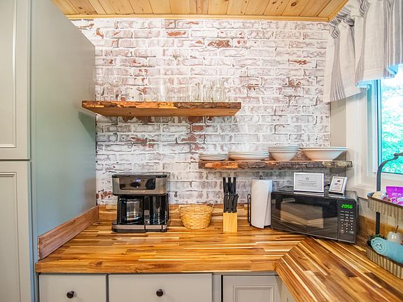 Full kitchen includes coffee maker, microwave, dishes