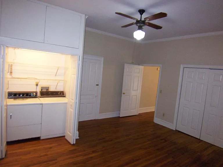 Bedroom view from corner looking to entry and laundry area
