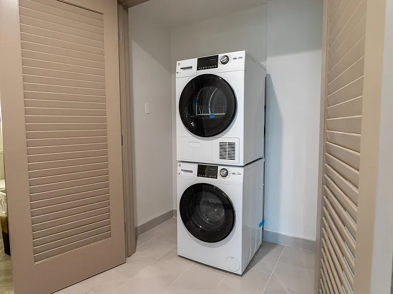 454 sq ft studio laundry and spacious hall closet.