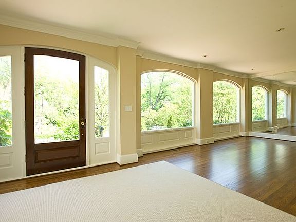 WELCOMING ENTRY FOYER OPEN TO SUNNY GALLERY