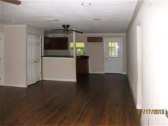 View from the front door looking towards the Open concept kitchen and eating area.