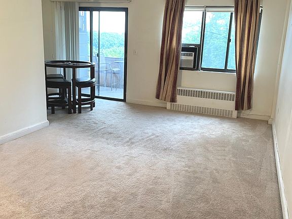 Apartment Entry View to Balcony - Large Living Room - Dining Area Off Kitchen
