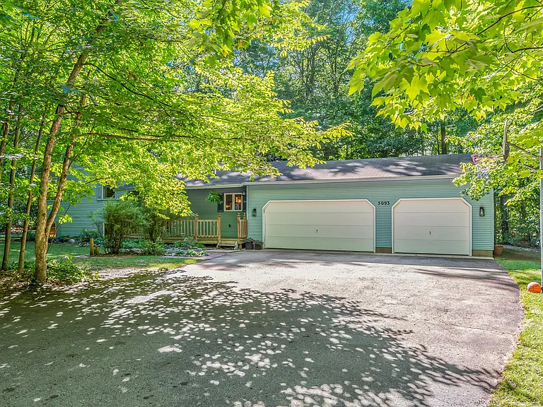 3-car garage and a basketball hoop