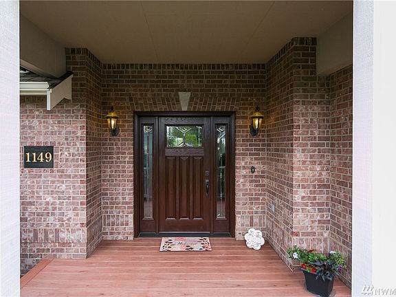 Elegant covered front entry with new front door & trex  