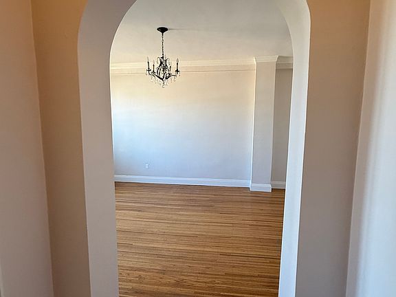Archway from hallway into living room area.