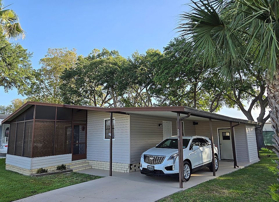 Carport with shed