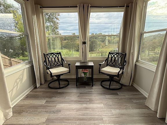 Sunroom with amazing views of sunset and backyard.