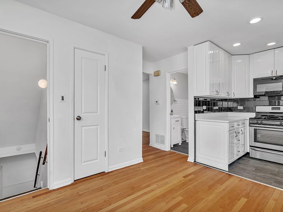 Kitchen, half bath, stairs down