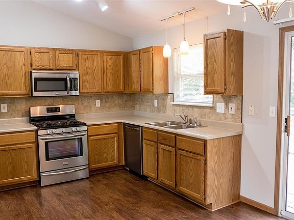 Kitchen offers nice stainless steel appliances, updated countertop and pantry