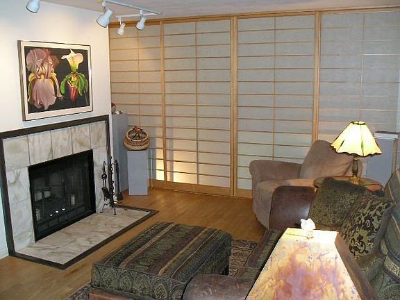 Living room with the shoji screens closed. The dining room is behind the screens.