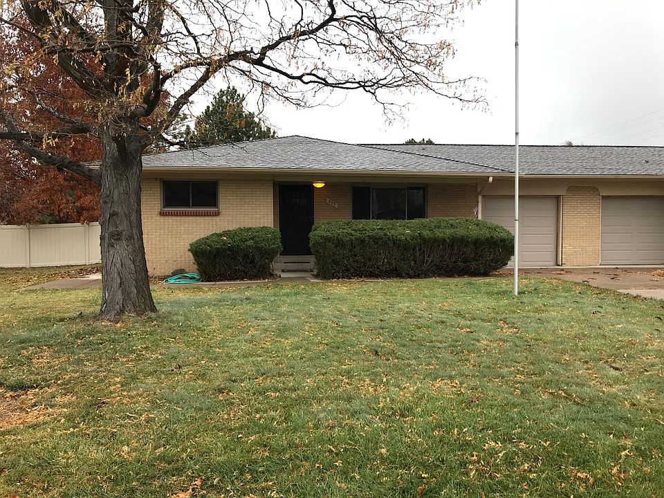 Street View of Duplex with Locust Tree