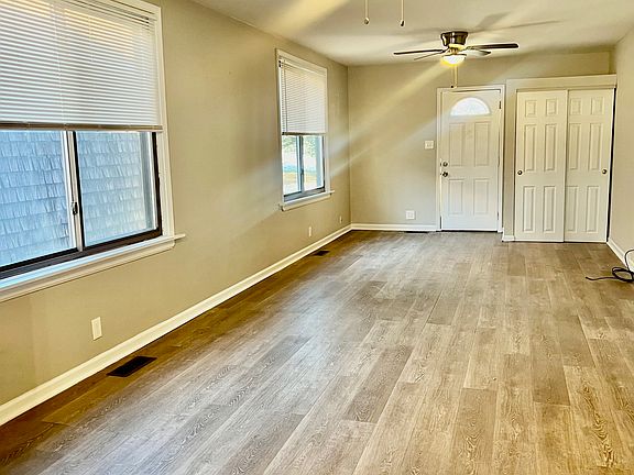 View of same space looking from kitchen to front door.