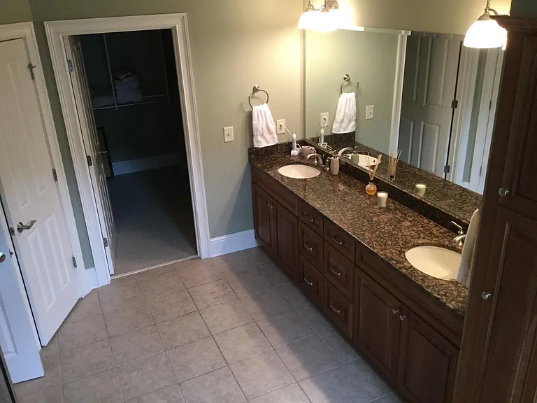 Master bath with full walk in closet (california closets)