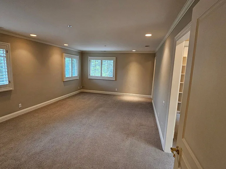 Master Bedroom with WIndows overlooking the yard