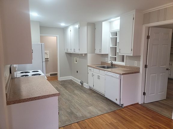 The galley style KITCHEN is adjacent to the DINING AREA - FAMILY ROOM - LIVING ROOM.
