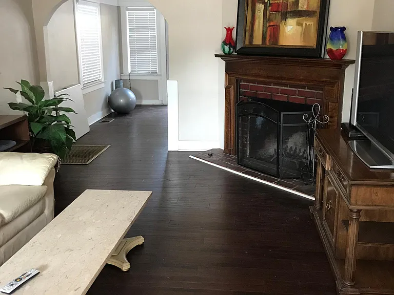 Living room wood burning fireplace.