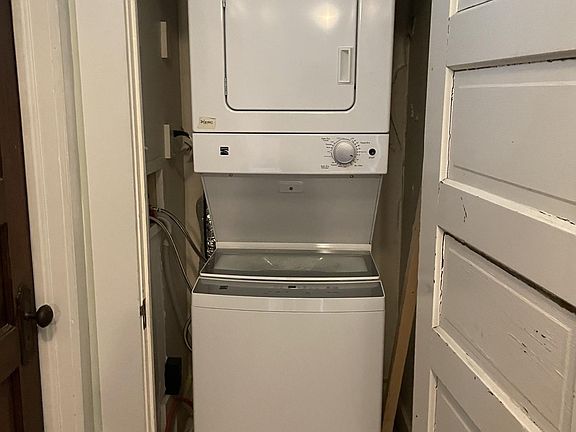 Stacked Washer and Dryer tucked in the hallway closet