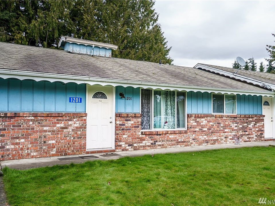 Extensive brick work, scalloped facia boards and roof cupolas add curb appeal and character to this property.