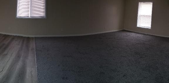 Panoramic view of kitchen and living area