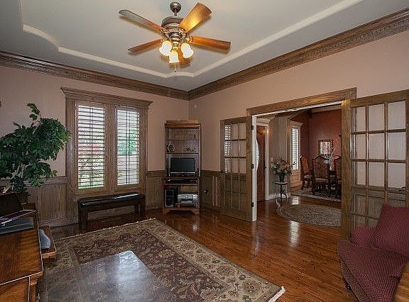 Hardwood floors and decorative ceiling in office