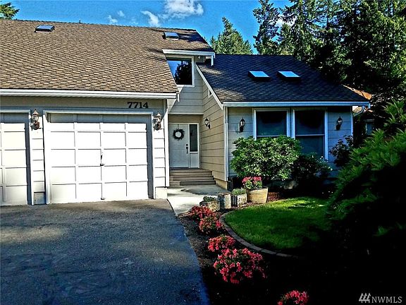 3 car garage and beautiful landscaping