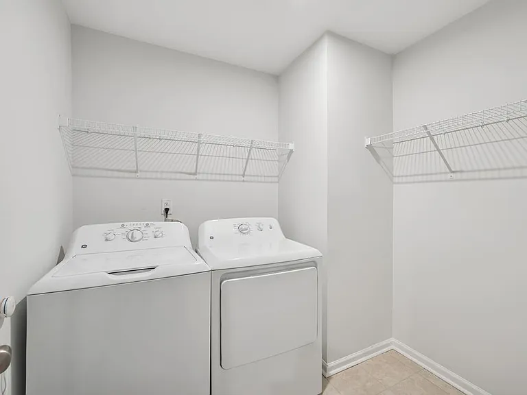 Laundry room with full-size washer and dryer
