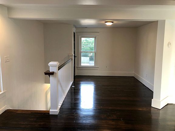 Living Room and stairs down to main entrance.