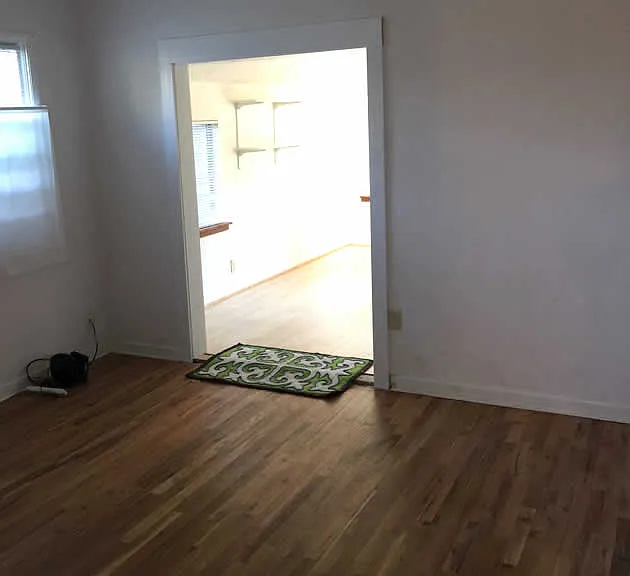 Larger bedroom opening to back sunroom.