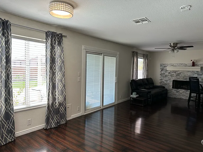 Bright and spacious living room opening to the backyard.
