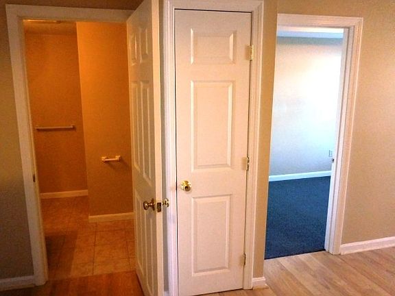 view from kitchen into bath and bedroom