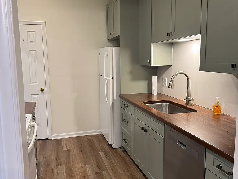 Kitchen is fully equipped with dishwasher, stove, refrigerator, a pantry and disposal.