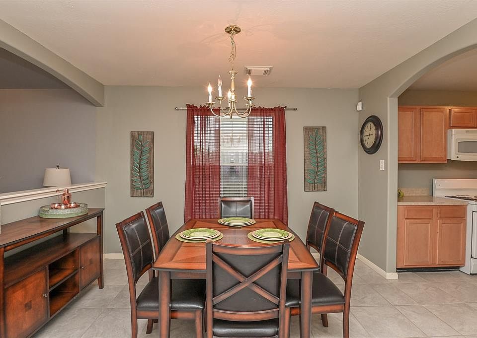 The formal dining space is open to the kitchen work-zone, making serving and entertaining so easy.