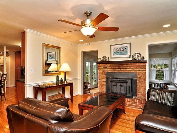 Den with wood fireplace